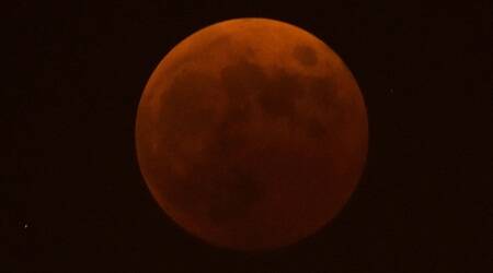 A red tinged moon seen during a total lunar eclipse