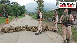 Security personnel stand guard at the violence-hit area of Manipur's Kanto sabal, in Imphal West on Tuesday. (ANI Photo)